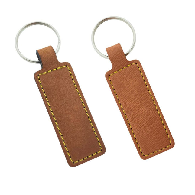 Llavero en cuero o cuero sintético 23x95mm - Por unidad